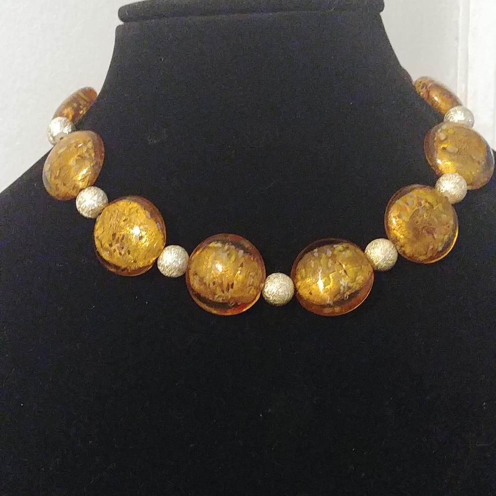 A 15 inch with 3-1/2 inch extender necklace of gold glass discs & silver beads